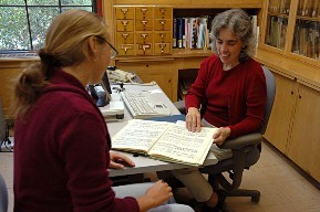 Female librarian and woman