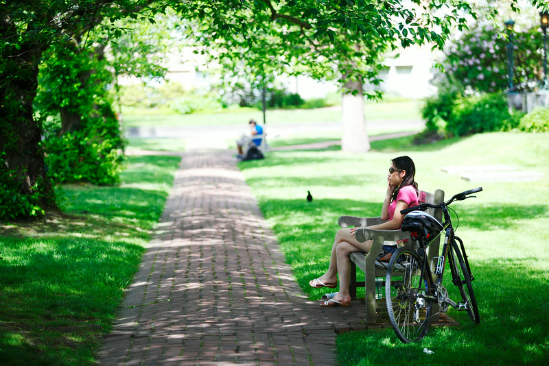 Woman with bicycle in the Quad